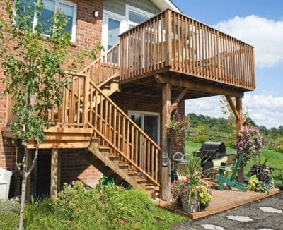 Multilayered wooden stairs and deck with railings