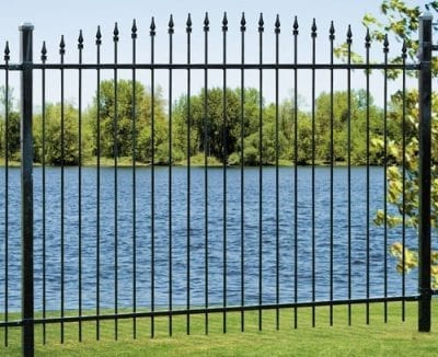 Iron fence leading to open water