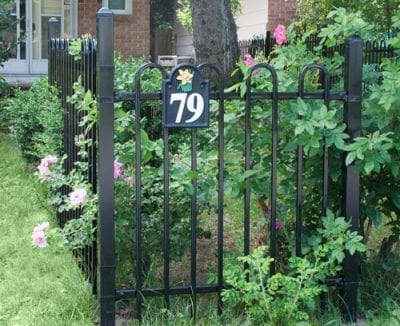 Iron fence with garden