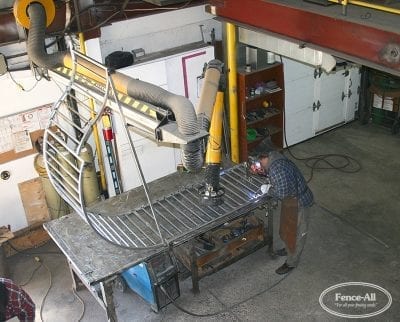 curved custom welded iron railing in progress